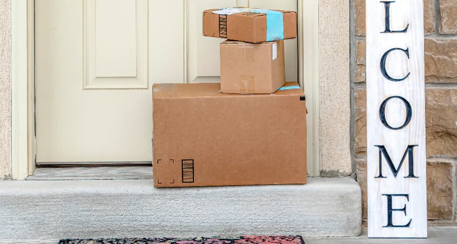 Deliveries on the front porch of a house with a welcome sign in San Jose